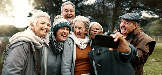 Image showing Excited, selfie and group of senior friends in outdoor green environment for fresh air. Diversity, happy and elderly people in retirement taking picture together while exploring and bonding in a park