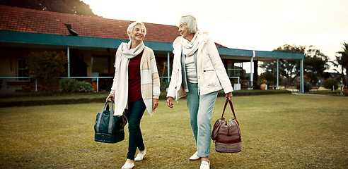 Image showing Retirement, hobby and senior woman friends walking on a field at the bowls club together for a leisure activity. Smile, talking and elderly people on the green of a course for bonding or recreation