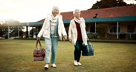 Image showing Retirement, hobby and senior woman friends walking on a field at the bowls club together for a leisure activity. Smile, talking and elderly people on the green of a course for bonding or recreation