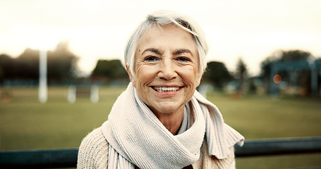 Image showing Face, senior woman and smile on park bench on vacation, holiday or travel in winter. Portrait, happy and elderly person in nature, outdoor or garden for freedom to relax for retirement in Australia