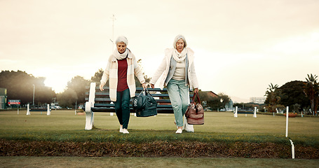 Image showing Retirement, hobby and senior woman friends walking on a field at the bowls club together for a leisure activity. Smile, talking and elderly people on the green of a course for bonding or recreation