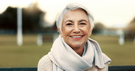 Image showing Face, elderly woman and happy on park bench on vacation, holiday or travel in winter. Portrait, smile and senior person in nature, outdoor or garden for freedom to relax for retirement in Australia
