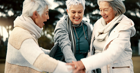 Image showing Fitness, park or senior women in huddle, training or exercise for wellness, solidarity or teamwork outdoors. Happy ladies, group success or elderly friends raising arms for workout support together