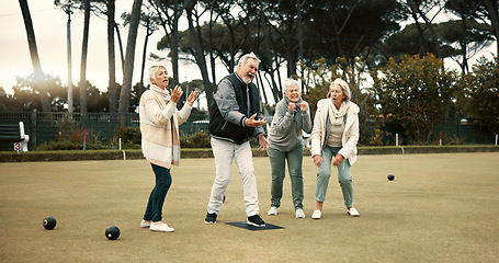 Image showing Senior man, team and bowling on grass with miss, fail or support for fitness, sport or game in retirement. Teamwork, group and elderly women with metal ball, exercise or kindness for training on lawn