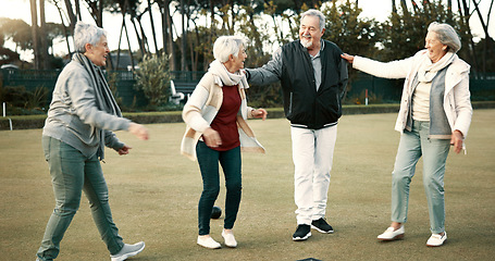 Image showing Bowls, celebration and hugging with senior friends outdoor, cheering together during a game. Motivation, support or applause and a group of elderly people clapping while having fun with a hobby