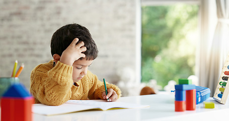 Image showing Child, drawing or boy writing homework on notebook in kindergarten education for growth development. Project, creative or young art student with color pencil learning or working on sketching skills