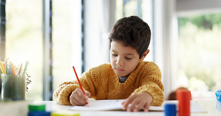 Image showing Student, drawing or boy writing homework on notebook in kindergarten education for growth development. Project, creative or young kid artist with color pencil learning or working on sketching skills