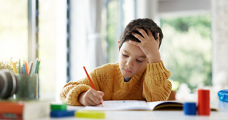 Image showing Child, drawing or boy writing homework on notebook in kindergarten education for growth development. Project, creative or young art student with color pencil learning or working on sketching skills