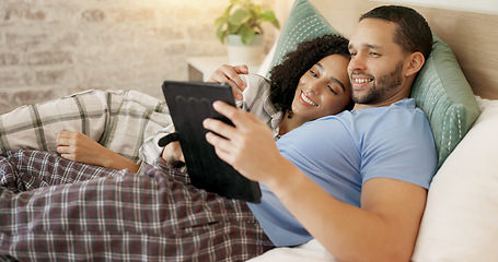 Image showing Couple, tablet and scroll in bed, morning and bond with internet video, movie and meme for love, care and hug. Man, woman and digital touchscreen for typing, social network app or web blog in house