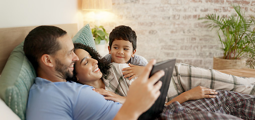 Image showing Family, bed and watching on tablet with a smile and cartoon with mom, dad and kid together. Bedroom, tech and education children program with mother, father and young boy with a youth movie at home