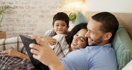Image showing Family, bed and watching on tablet with a smile and cartoon with mom, dad and kid together. Bedroom, tech and education children program with mother, father and young boy with a youth movie at home