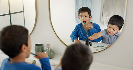 Image showing Boy kids, toothbrush and together in bathroom for hygiene, wellness and self care with dental product in family home. Young male children, teeth whitening and mirror for health, learning and cleaning