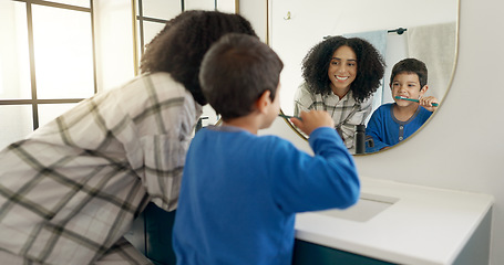 Image showing Woman, child and brushing teeth in bathroom with mirror, dental care in home with toothpaste, water and hygiene. Kid, mom and toothbrush, teaching, learning and cleaning mouth morning with reflection