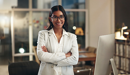 Image showing Night, arms crossed and face of happy woman, office consultant or HR manager happy for workplace empowerment. Pride, portrait and Indian person confident, professional and working on human resources