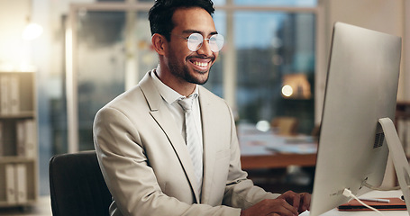 Image showing Office computer, night and happy man typing email, communication and networking with business consultant. Smile, reading and professional person contact social media user, network admin or employee