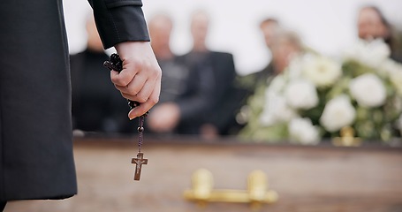 Image showing Funeral, religion and hands with rosary for memorial service, death ceremony and obituary sermon. Christianity, burial and closeup of pastor or priest with religious symbol for gospel, faith and loss