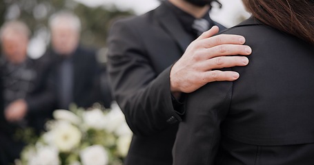 Image showing Funeral, support and people care for grief, mourning or depressed mother at burial ceremony, memorial service or cemetery. Hand, shoulder and man helping sad woman with love, advice or family comfort