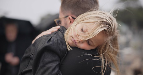 Image showing Sad, death and a daughter with her father at a funeral for grief or mourning loss together outdoor. Family, empathy and a man holding his girl child at a memorial service or ceremony for condolences