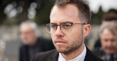 Image showing Thinking, sad and a man at a funeral or graveyard with depression, problem or frustrated. Idea, mental health and a person at a cemetery and walking for mourning, grief or loss in the family