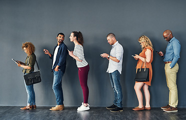 Image showing Businesspeople, waiting and queue with technology for hiring, job recruitment or onboarding. Men, women and corporate diversity in line with cellphone for staff interview, human resources or meeting