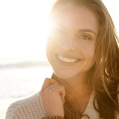 Image showing Portrait, summer and woman on beach at sunset for travel, tropical vacation or island holiday closeup. Face, smile and nature with happy young tourist outdoor on coast by sea or ocean in paradise