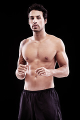 Image showing Man, portrait and fitness with fighter in a studio ready for boxing training and workout. Body, athlete and male boxer from Brazil with exercise, sport and wellness for battle with black background