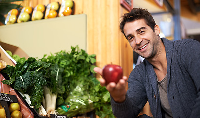 Image showing Apple, portrait or happy man shopping at a supermarket for grocery promotions, sale or discounts deal. Smile, offer or customer buying groceries for healthy nutrition, organic fruits or diet choice