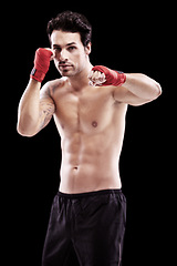 Image showing Man, portrait and fitness with boxer fist in a studio with boxing training and workout. Body, athlete and male fighter from Brazil with exercise, sport and wellness for battle with black background