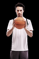 Image showing Basketball, portrait and fitness man with ball in studio for training, wellness or exercise challenge on black background. Workout, face and male athlete with handball, catch or performance match