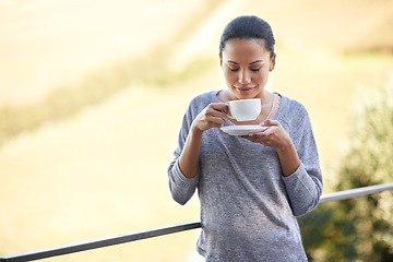 Image showing Woman, coffee and relax on balcony outdoor, aroma and warm beverage with morning routine and zen in nature. Peace, mockup and espresso for caffeine or happiness with smile and tea cup in countryside