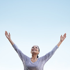 Image showing Woman, arms up and blue sky with freedom and happiness outdoor, health and wellness, stress relief and gratitude, Celebration, joy and smile on face in nature with mockup space, praise and thanks