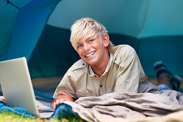 Image showing Child, boy and happy with laptop in tent for camping, social media and online movie with portrait in nature. Person, face and kid with smile outdoor on grass for gaming, vacation and holiday fun