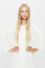 Image showing Blonde woman, portrait and fashion in confidence for natural beauty in haircare, cosmetics or makeup on a white studio background. Face of young female person or attractive model in stylish outfit