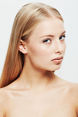Image showing Portrait, model and beauty or cosmetic in studio, confident and cosmetology for facial skin treatment. Young woman, face and shine in self care or blonde hair and organic make up by white background