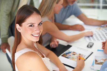 Image showing Magazine, design and portrait of woman in meeting with team project, collaboration and creative planning. Happy, person and photographer work at table with catalog, portfolio and editing process