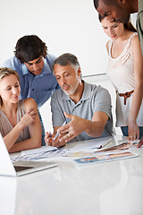 Image showing People, teamwork and paperwork or brainstorming at creative agency for collaboration, problem solving or idea. Diversity, documents and creativity pictures on desk for campaign, career or project