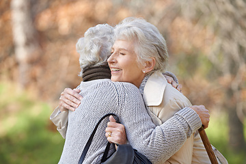 Image showing Nature, smile and senior friends hugging for support, bonding or care in outdoor park or garden. Happy, love and elderly women in retirement embracing for greeting, connection or trust in field.