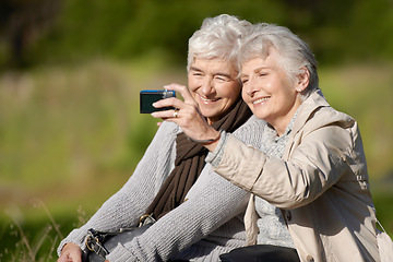 Image showing Senior friends, outdoor and selfie for photography, picture and happy for memories in nature and elderly. Women, bonding and chatting with smile, funny and laughing together in retirement