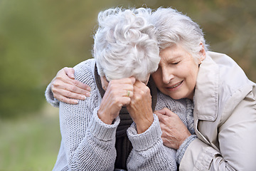 Image showing Senior woman, empathy and crying in nature, depression and grief in outdoor environment. Elderly people, garden and comforting or consoling in park, sadness and friend hugging for care in retirement