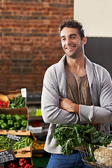 Image showing Smile, healthy food or happy man shopping in supermarket for grocery sale or discounts deal. Arms crossed, thinking or customer buying fresh produce for diet nutrition, organic vegetables or spinach