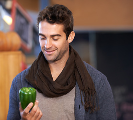 Image showing Pepper, food or man shopping at a supermarket for grocery promotions, sale or discounts deal. Smile, check or customer buying groceries for healthy nutrition, organic vegetables or diet with choice