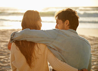 Image showing Beach hug, sunset and couple relax with summer sunshine, wellness and bonding on travel holiday in Greece. Embrace, marriage love and back of people connect with soulmate on anniversary or vacation