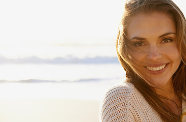 Image showing Portrait, beach and woman with vacation, smile and getaway trip with water and weekend break. Face, person and girl with mockup space or ocean with travel, relaxing or peace with adventure or journey