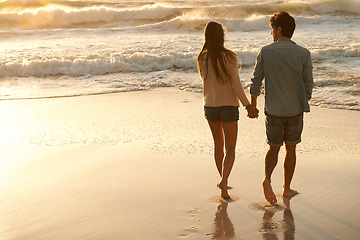 Image showing Beach sunset, love and couple holding hands on walk, sand journey or travel holiday for outdoor wellness in Peru. Mockup space, sea waves and back of man, woman or people on romantic tropical island