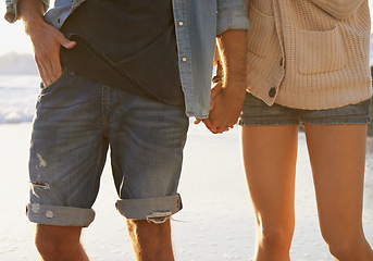 Image showing Beach, romance and couple holding hands on relax walk, nature journey or travel vacation in Peru. Love, relationship and closeup of marriage partner, soulmate or people bonding together in nature