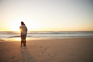 Image showing Couple, hug and beach sunset for summer travel or adventure, bonding or marriage. People, love and embrace at ocean water for dating tourism or back view for nature vacation, mockup or holiday