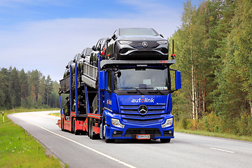 Image showing Blue Mercedes-Benz Car Carrier Truck Transports New Cars
