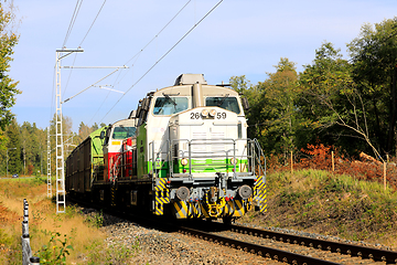 Image showing Two Diesel Locomotives Pulling Freight Train