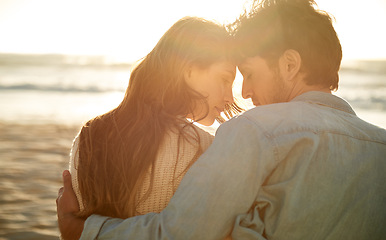 Image showing Love, sunset and beach couple relax with summer sunshine, wellness and bonding on travel holiday in Greece. Forehead touch, romance and back of man, woman or people connect with devotion to soulmate