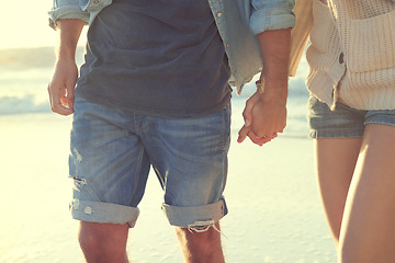 Image showing Beach, love and couple holding hands on relax walk, nature journey or travel holiday for outdoor wellness in Peru. Closeup, relationship partner or marriage people on romantic date on tropical island